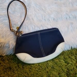 Blue and white Coach wristlet